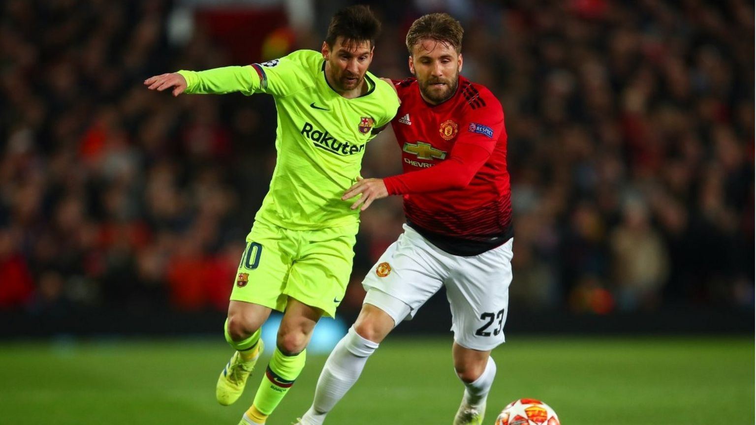 Lionel Messi of FC Barcelona and Luke Shaw of Manchester United during the UEFA Champions League Quarter Final first leg match