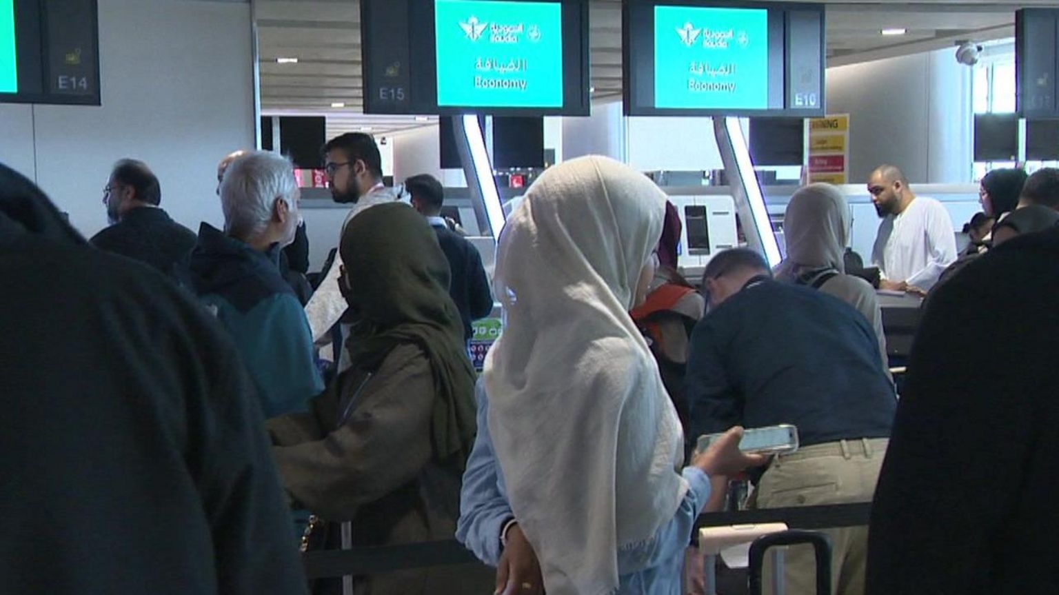 Pilgrims head through security at Manchester airport