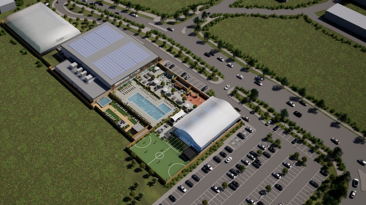 A CGI image of the planned David Lloyd site. Taken from above, you can see a small football pitch, swimming pool, several grey buildings and a car park.