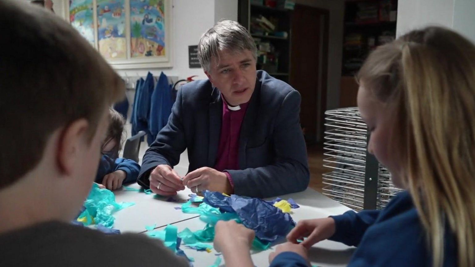 Bishop Hugh Nelson with two children 