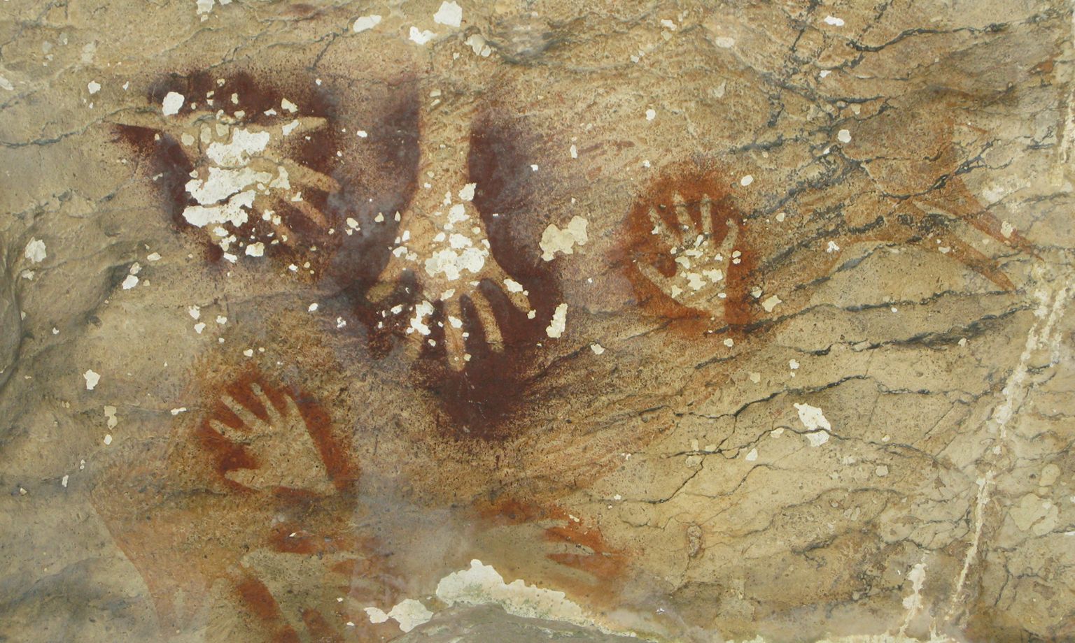 Hand paintings in Sumpang Bita cave, Indonesia
