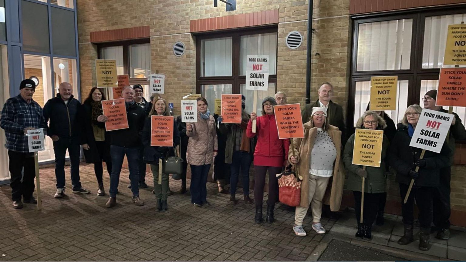 Campaigners outside the council meeting 