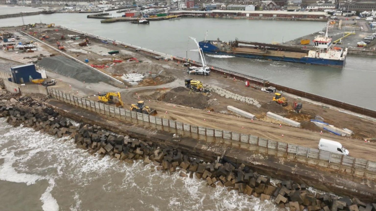 An aerial image of heaving machinery working on the outer harbour of the Port of Lowestoft