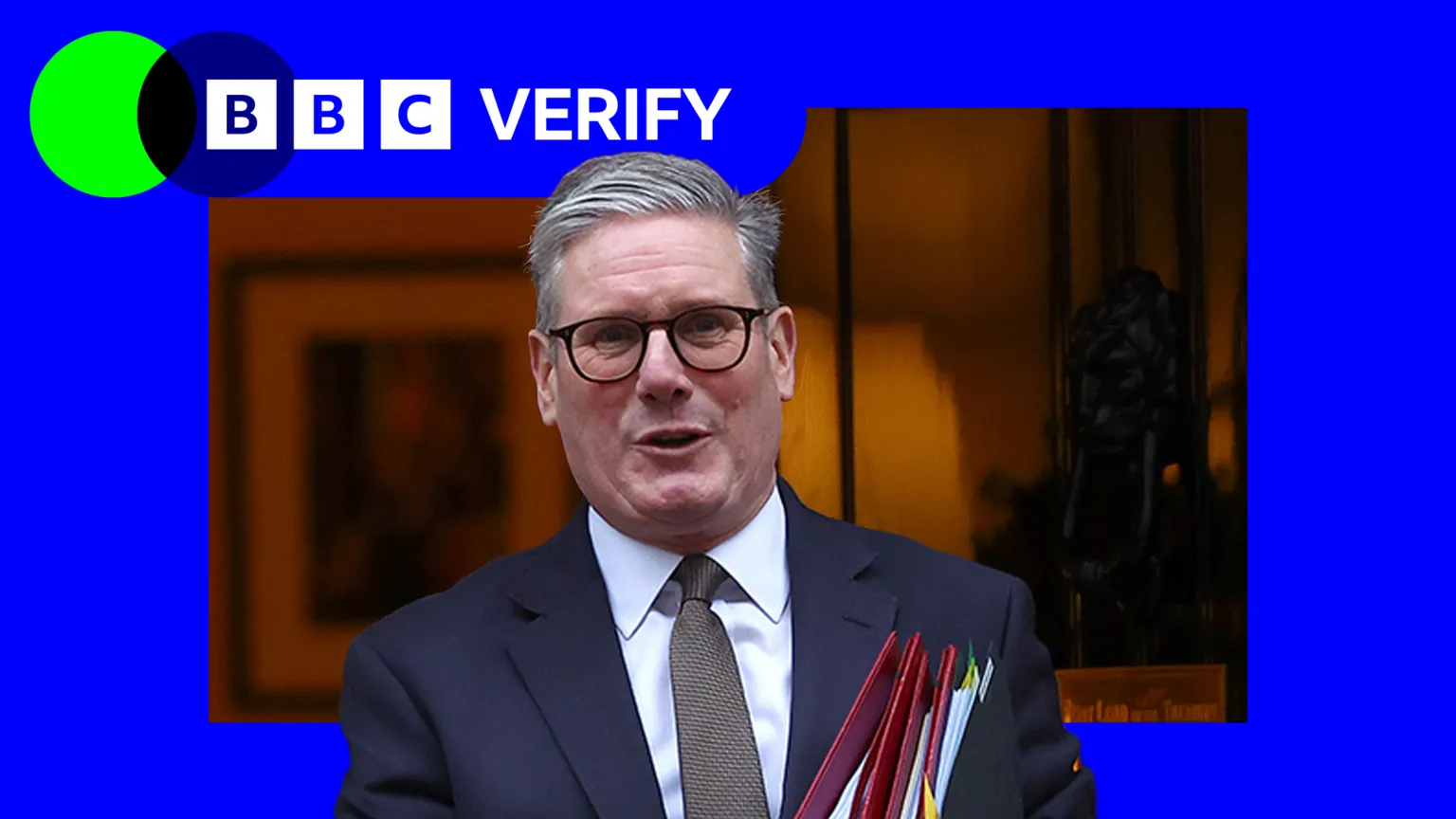 BBC Keir Starmer walking out of the door of 10 Downing Street carrying three folders. The BBC Verify lozenge is in the top left corner.