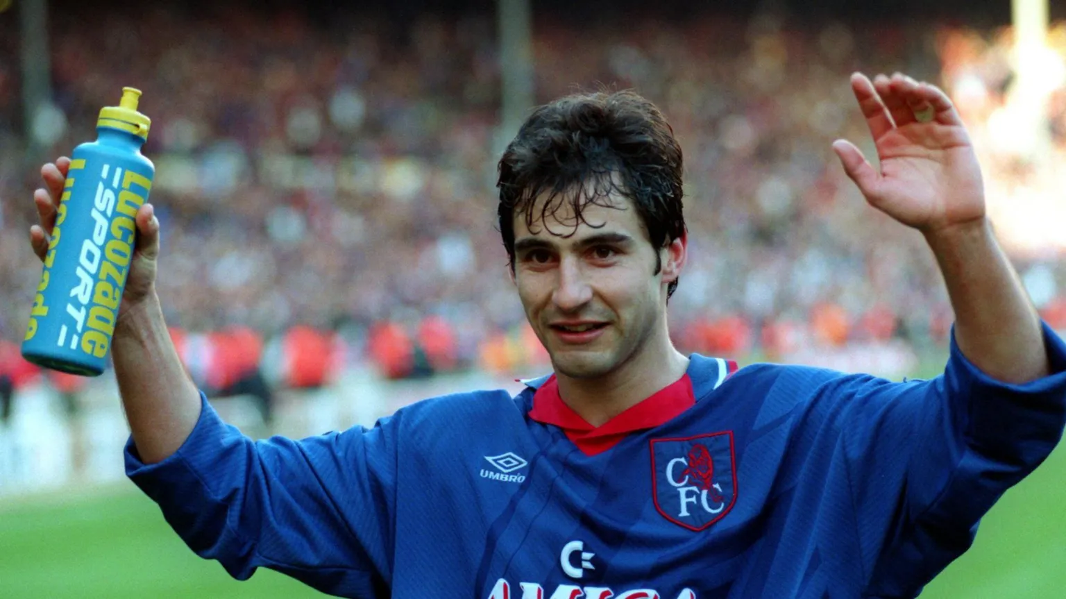 Getty Images A footballer with his hands in the air wearing an old Chelsea Football Club shirt