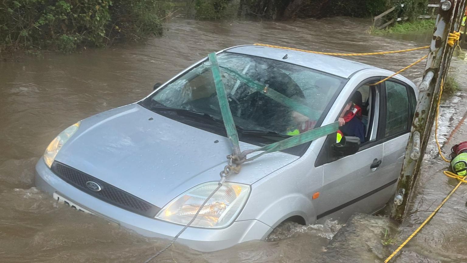 The car being winched from the flood-water