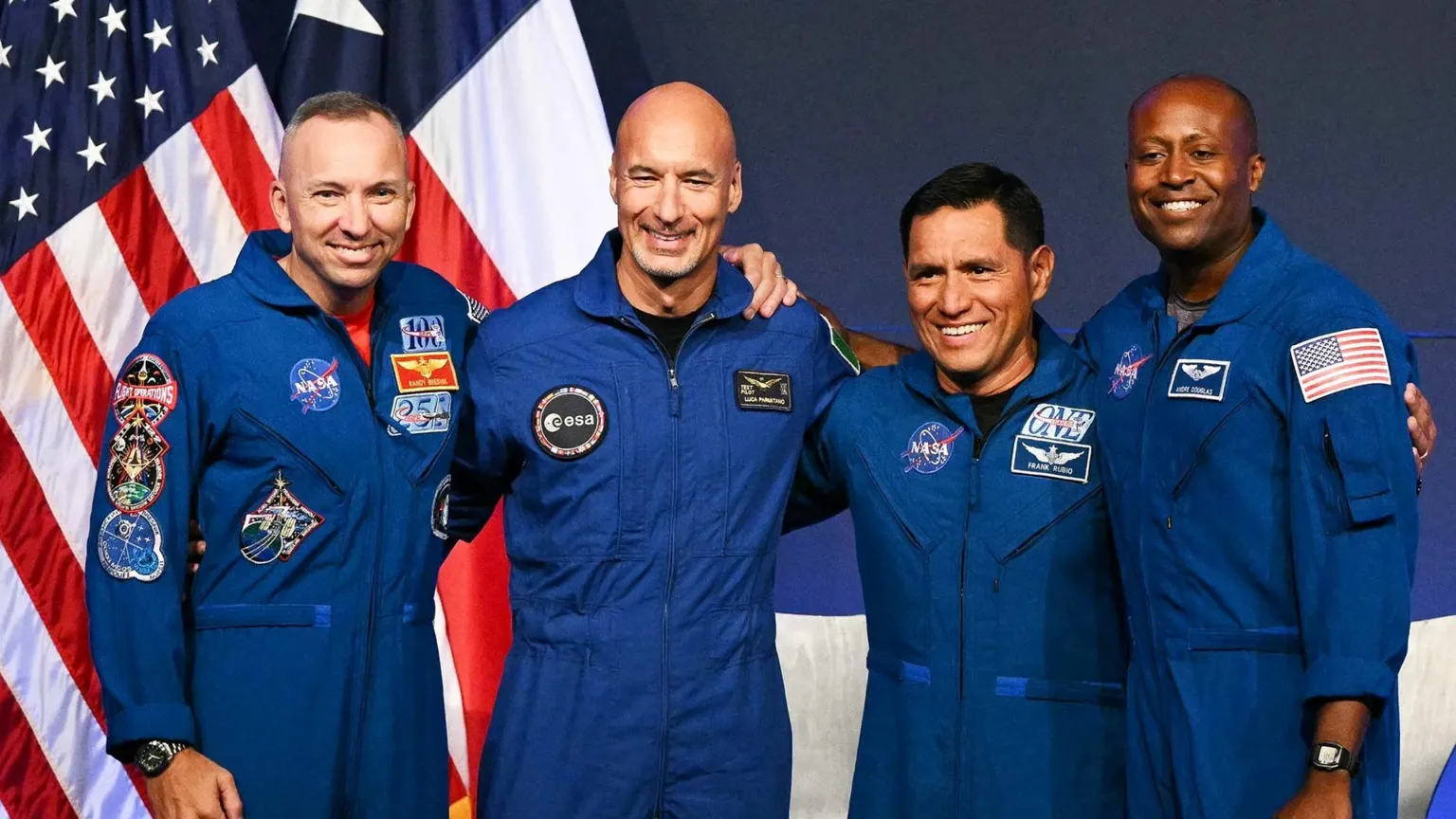 NASA astronaut commander Randy Bresnik, ESA (European Space Agency) astronaut pilot Luca Parmitano, NASA astronaut mission specialist Frank Rubio, and NASA astronaut mission specialist Andre Douglas speak during a press conference announcing the crew for the Artemis III mission at NASA's Johnson Space Center in Houston, Texas, on June 9, 2026.