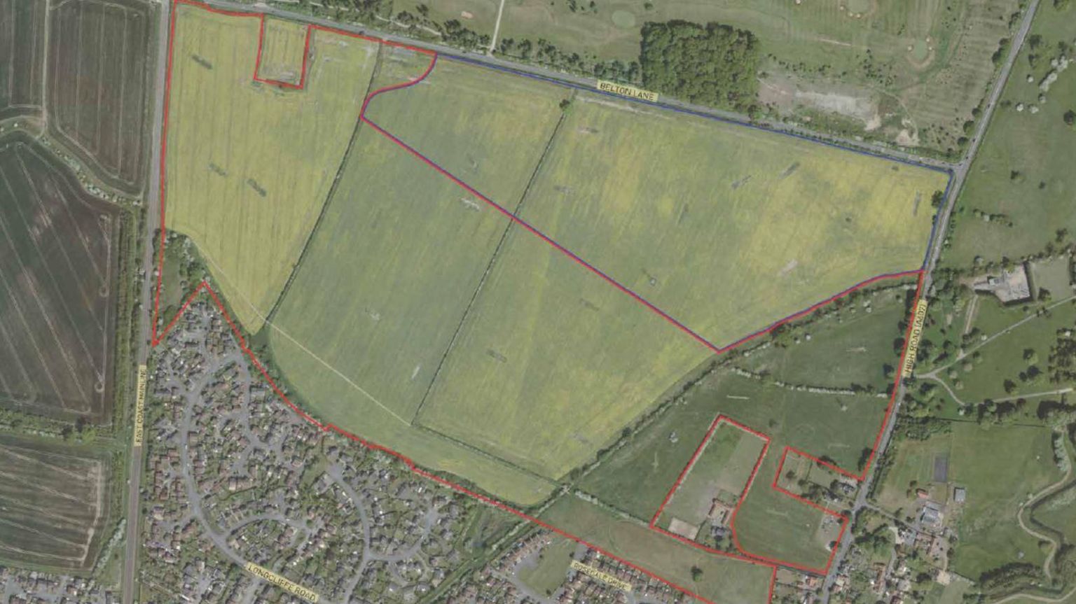 Aerial photo with red lines showing where the 480 new homes would be located