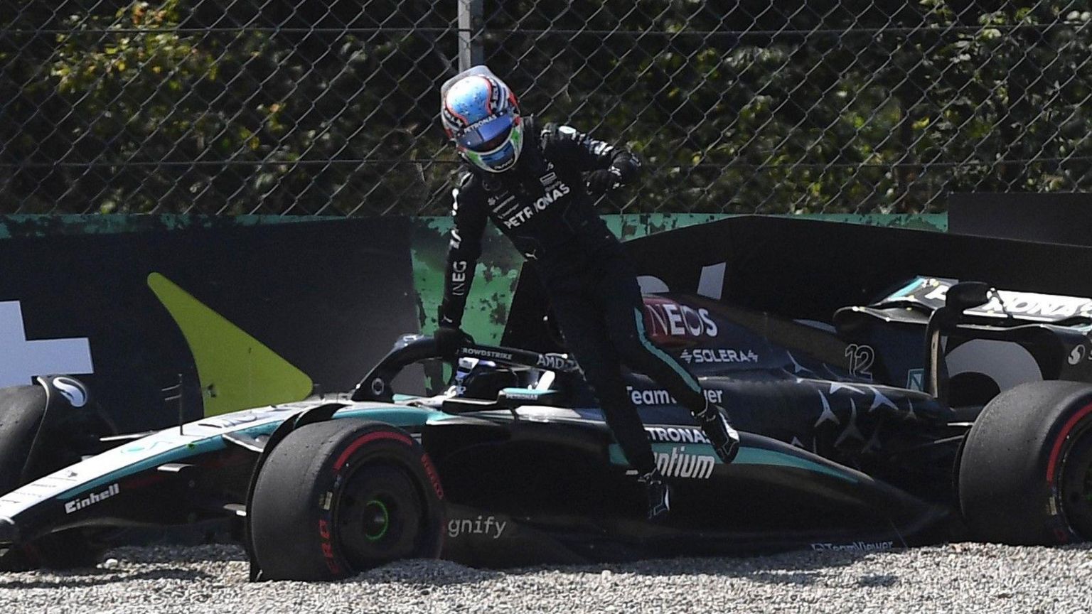 Andrea Kimi Antonelli gets out of his car after crashing