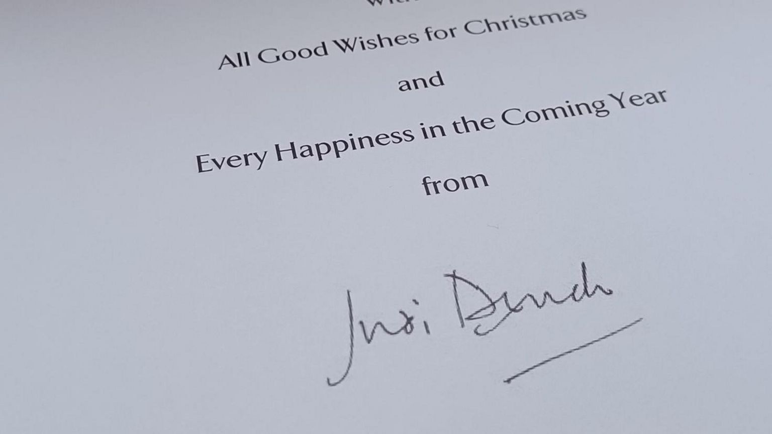 A Christmas card signed by Dame Judi Dench