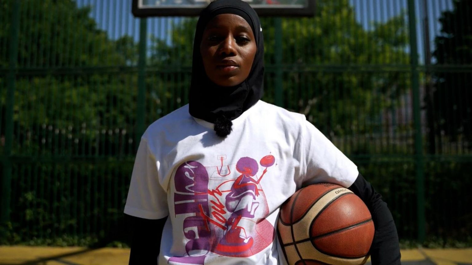 Basketball player Salimata Sylla carries a basketball