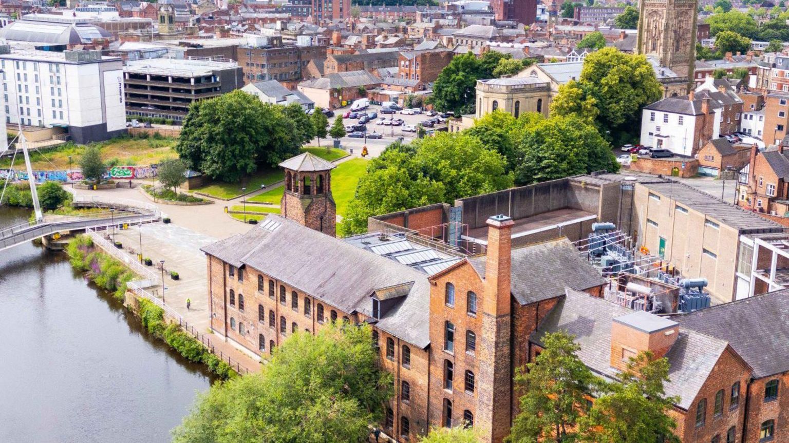 An aerial image of the Silk Mill in Derby with the city centre in the background