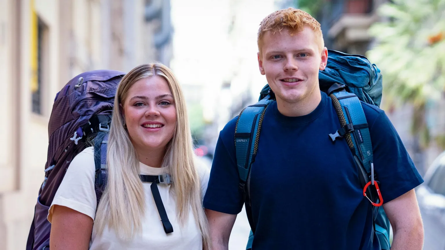 BBC/Studio Lambert Brother and sister Harrison and Katie with their backpacks on, smiling at the camera