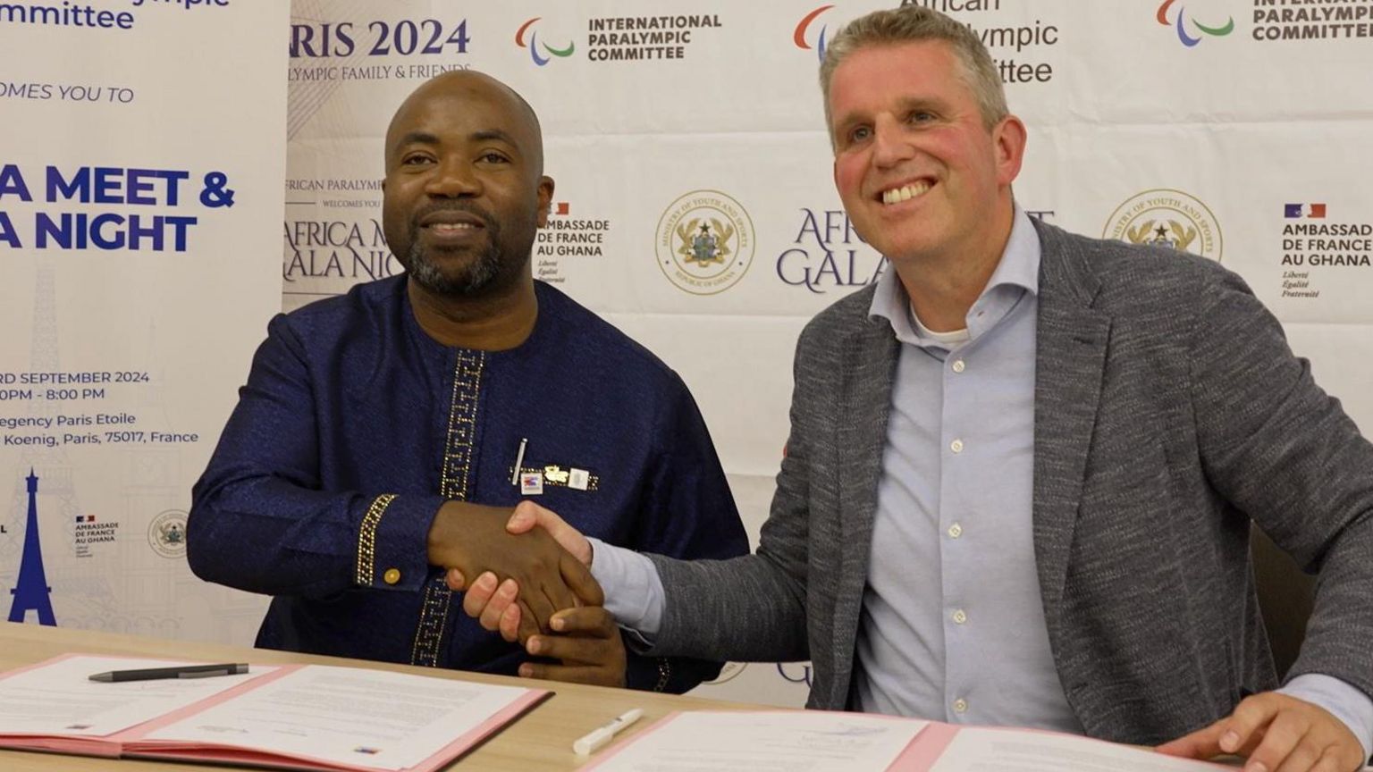 African Paralympic Committee president Samson Deen shakes hands with European Para Championships organiser Eric Kersten after signing a contract