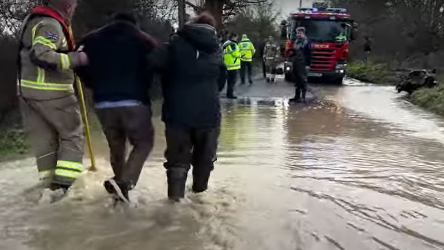 The driving instructor being assisted to awaiting emergency services