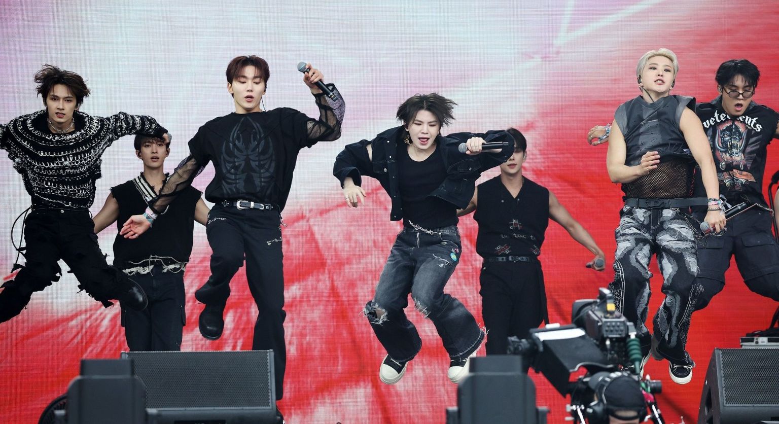 A K-Pop group performing on the stage