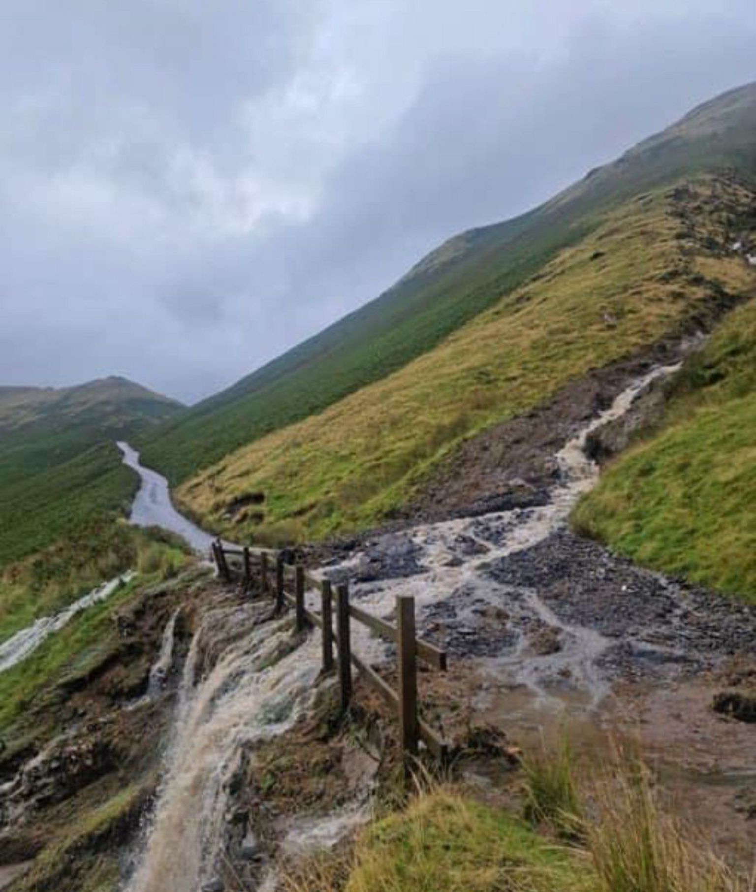 A landslide with water gushing over Newlands Pass near Buttermere as a result of Storm Lilian.