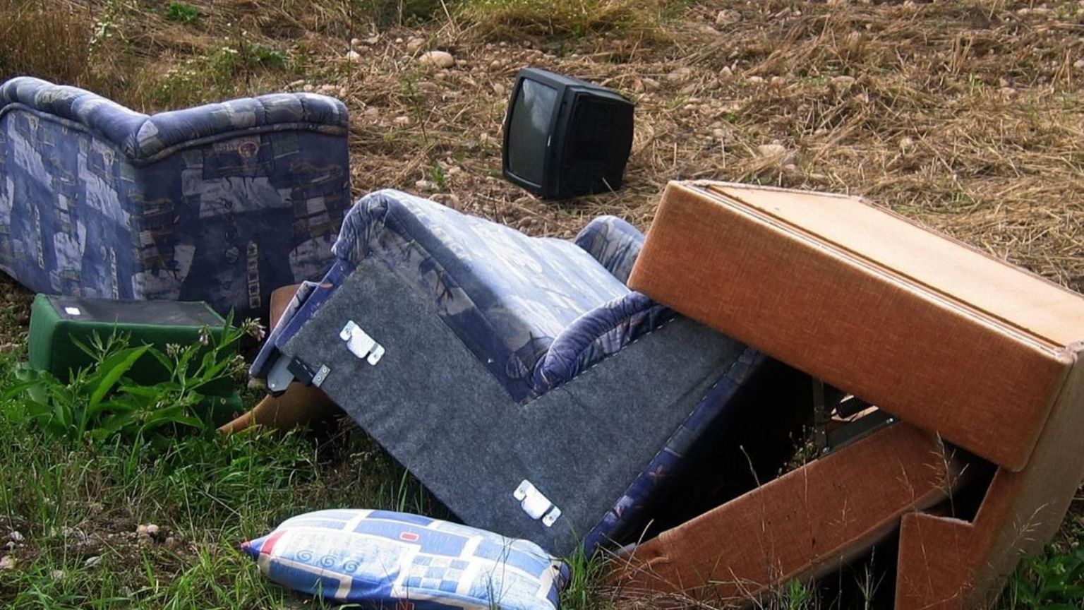 Dumped furniture and a television