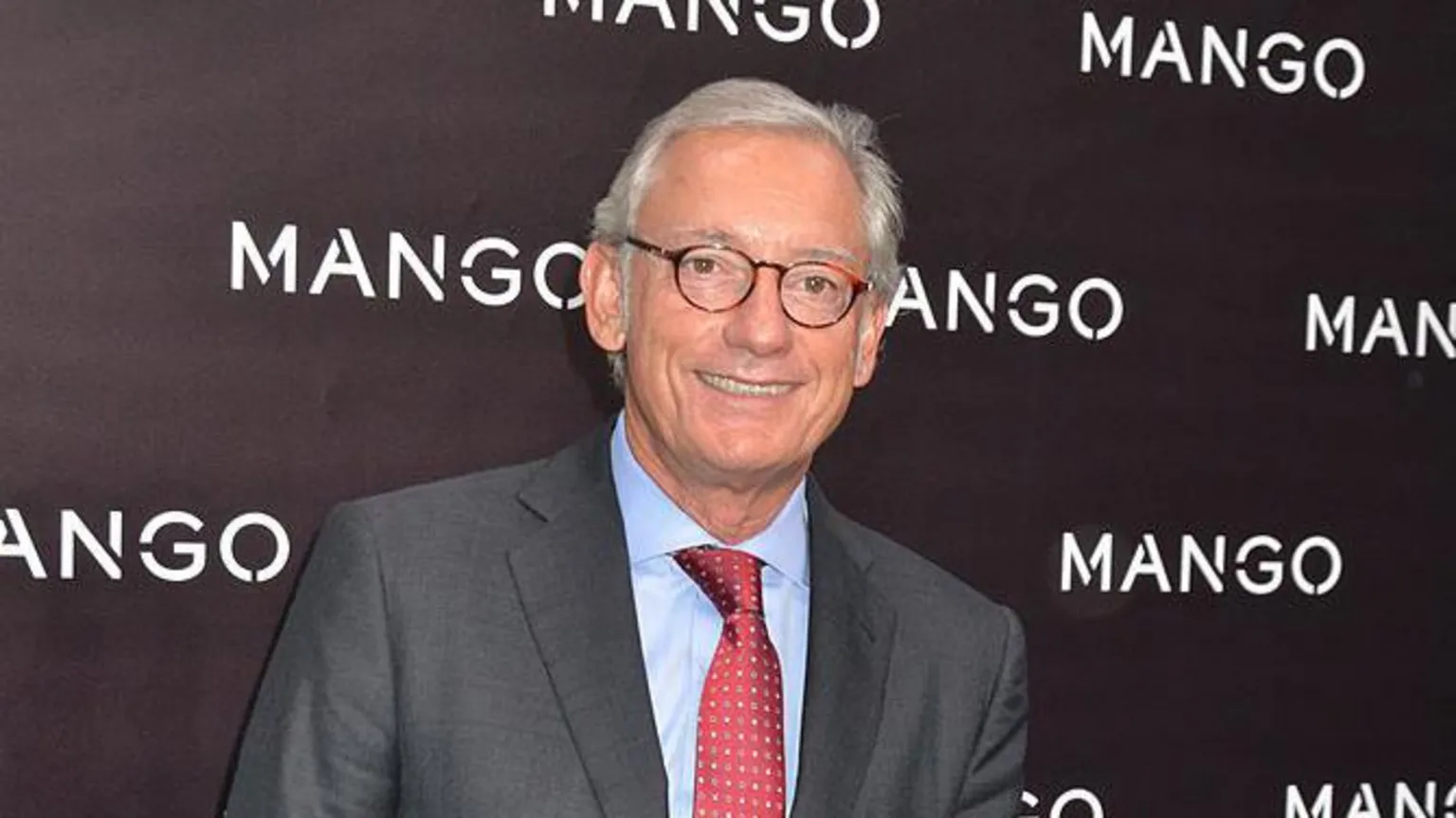 Foc Kan/WireImage A 2011 pic of a Isak Andic, with grey hair and a red tie and suit
