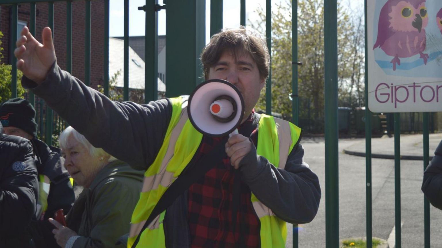 Campaigner Iain Dalton with a megaphone at a Save Little Owls nurseries protest