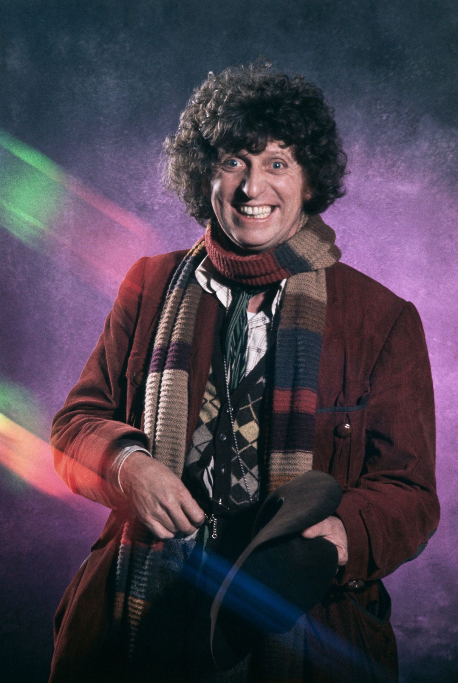 A smiling Tom Baker in costume as the 4th Doctor