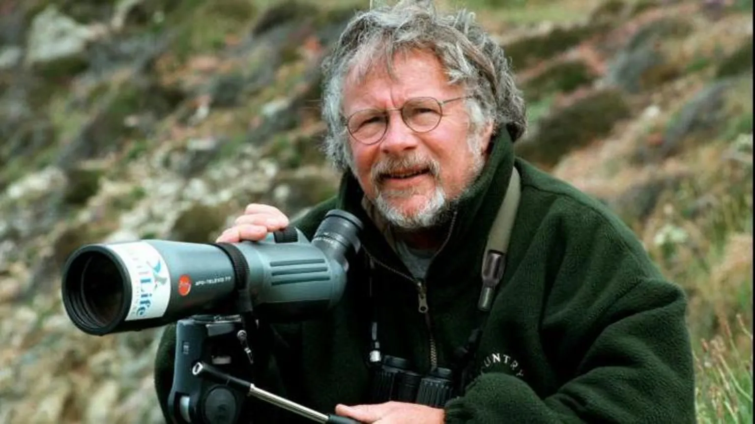 Bill Oddie out watching birds with a telescope