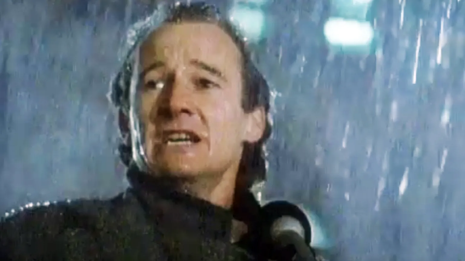 A still from The Holy City showing David Hayman as The Man on a Glasgow street