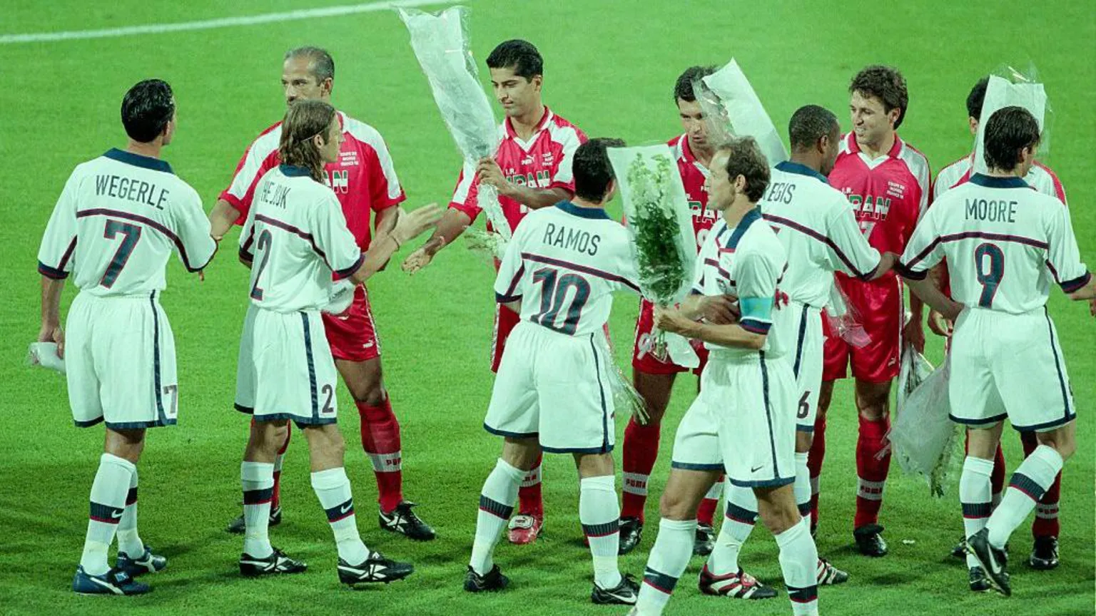 Getty Images L-R: Frankie Hejduk, Tab Ramos, Joe Max Moore, David Regis, Kasey Keller and Thomas Dooley of USA exchange flowers with the Iranian Team before the World Cup 1st round match between USA (1) and Iran (2) at the Stade de Garland on June 21, 1998 in Lyon, France.