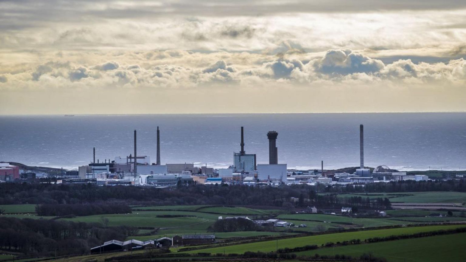 Large industrial buildings at Sellafield with the sea beyond