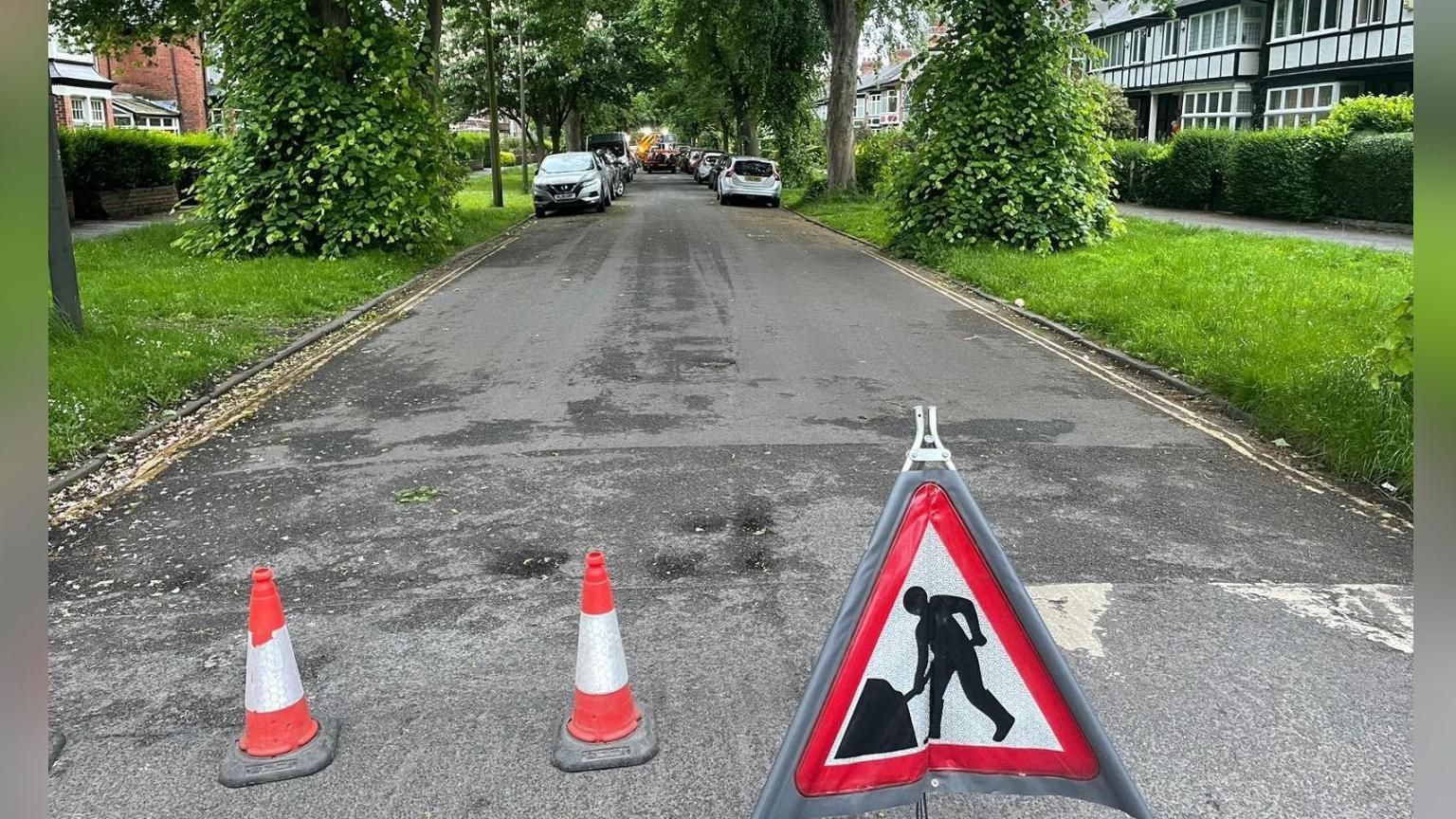 A roadworks sign and cones on a Hull road