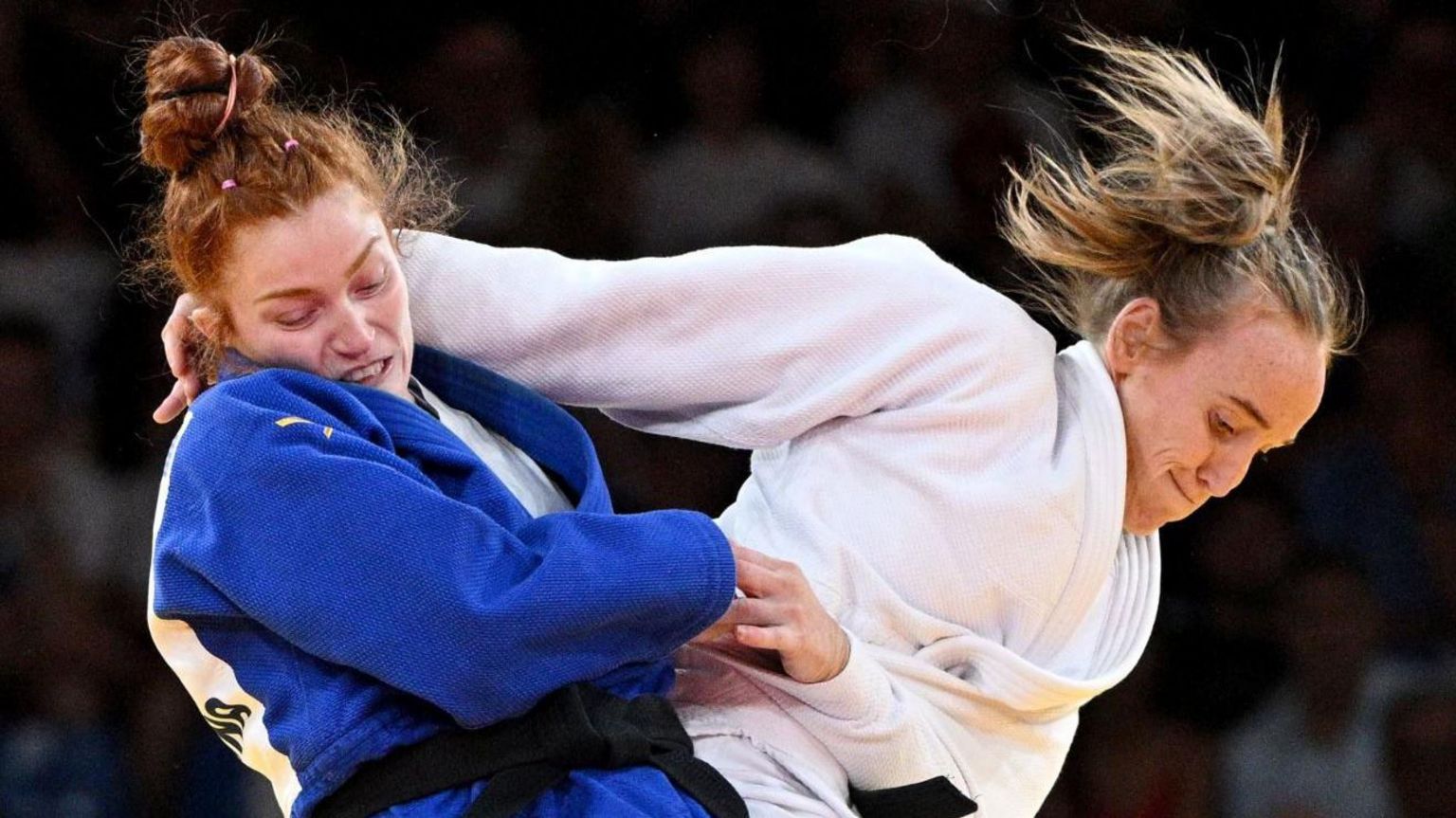 Lubjana Piovesana (blue) of Austria in action against Lucy Renshall of Great Britain in action during their Women -63kg Elimination Round 