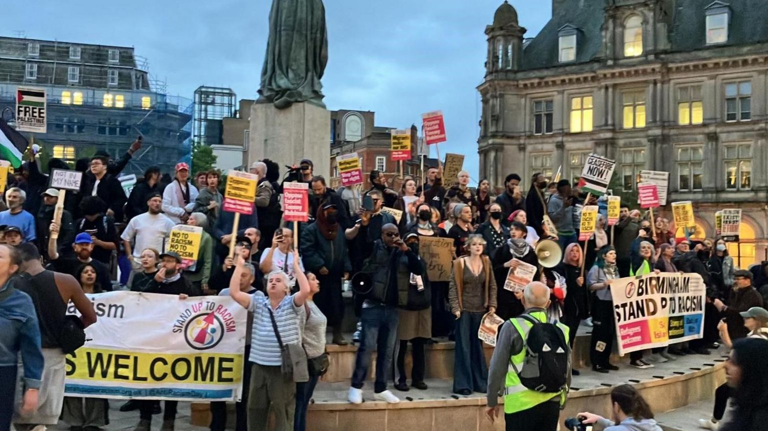 Around 150 people with banners saying 'refugees welcome' and Birmingham Stand Up To Racism placards