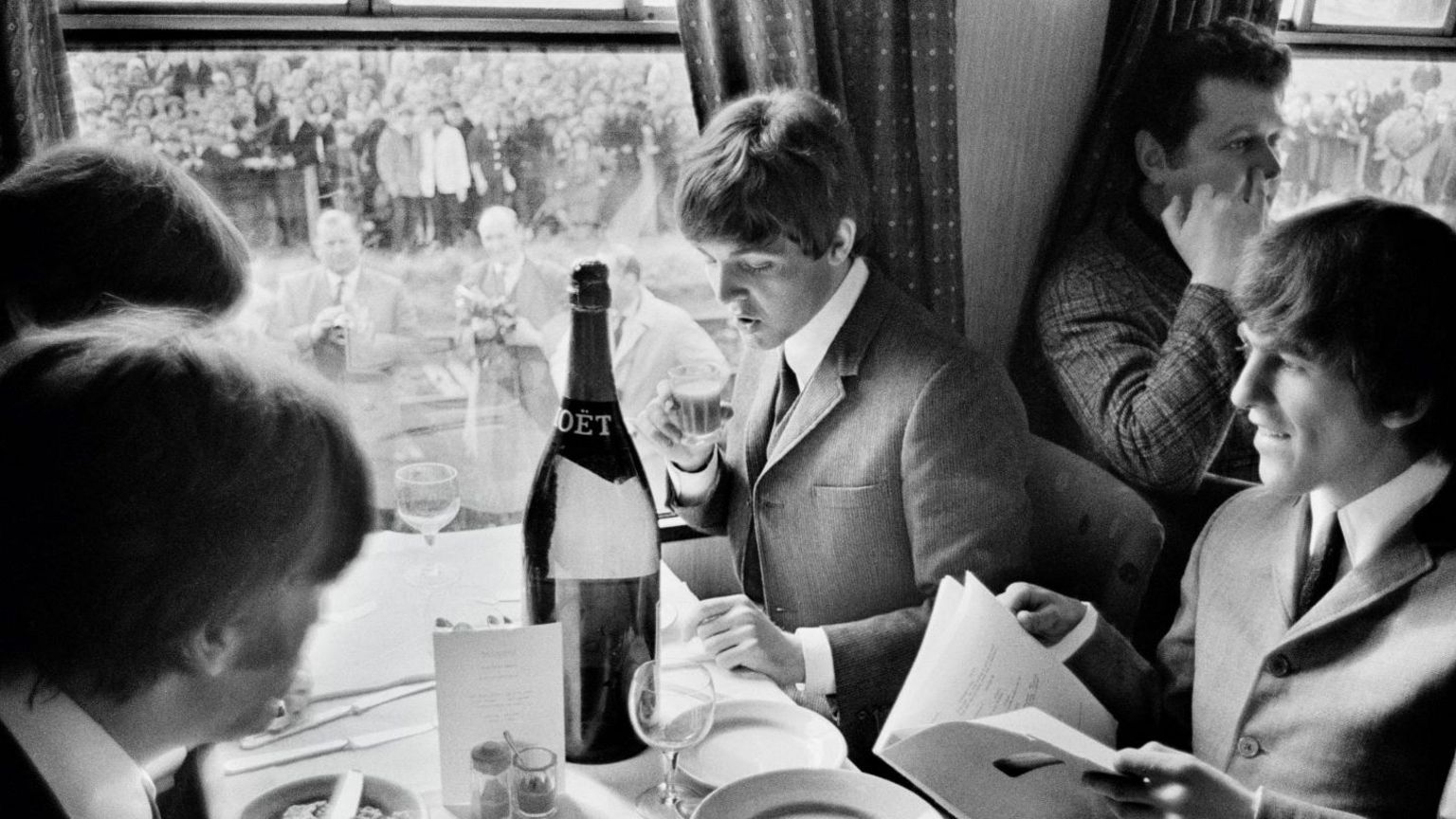 The Beatles on a train 