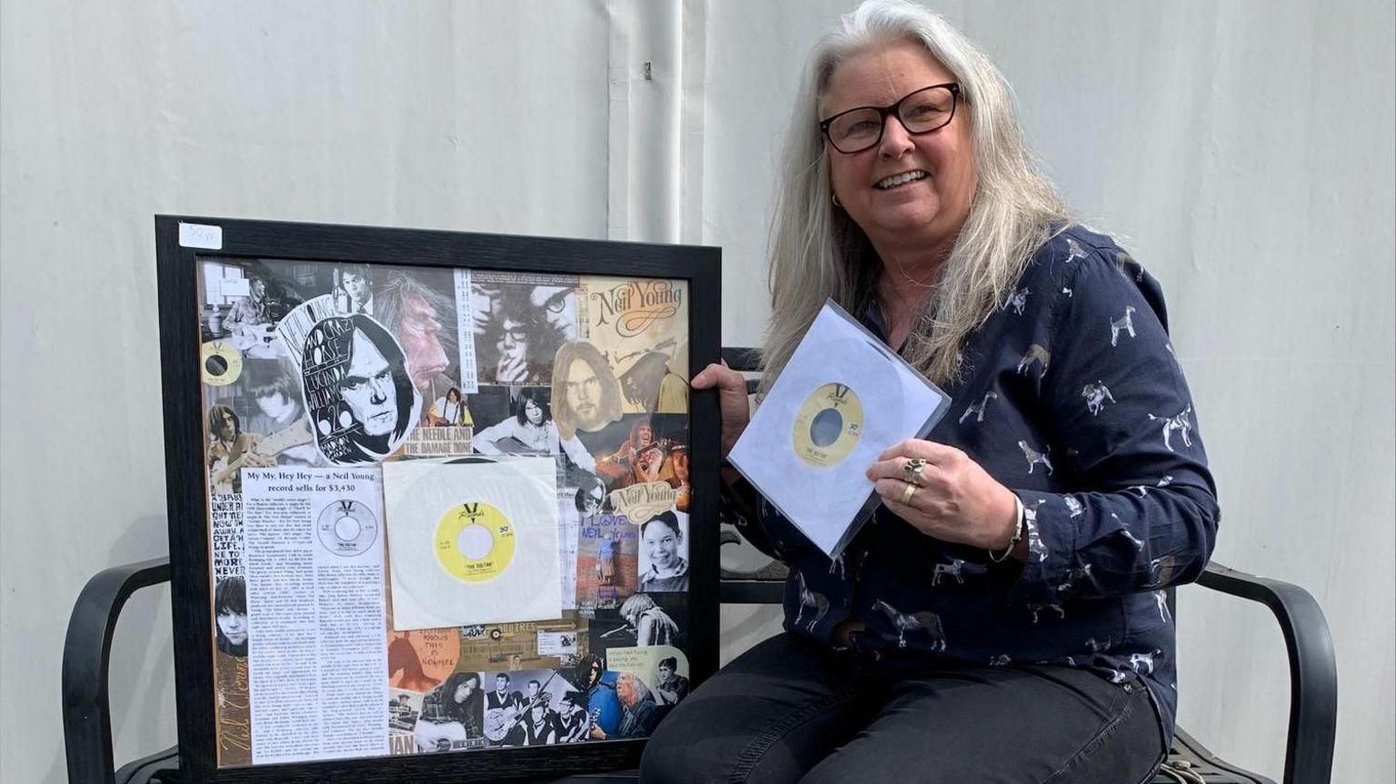 Claire Howell posing with collage and vinyl