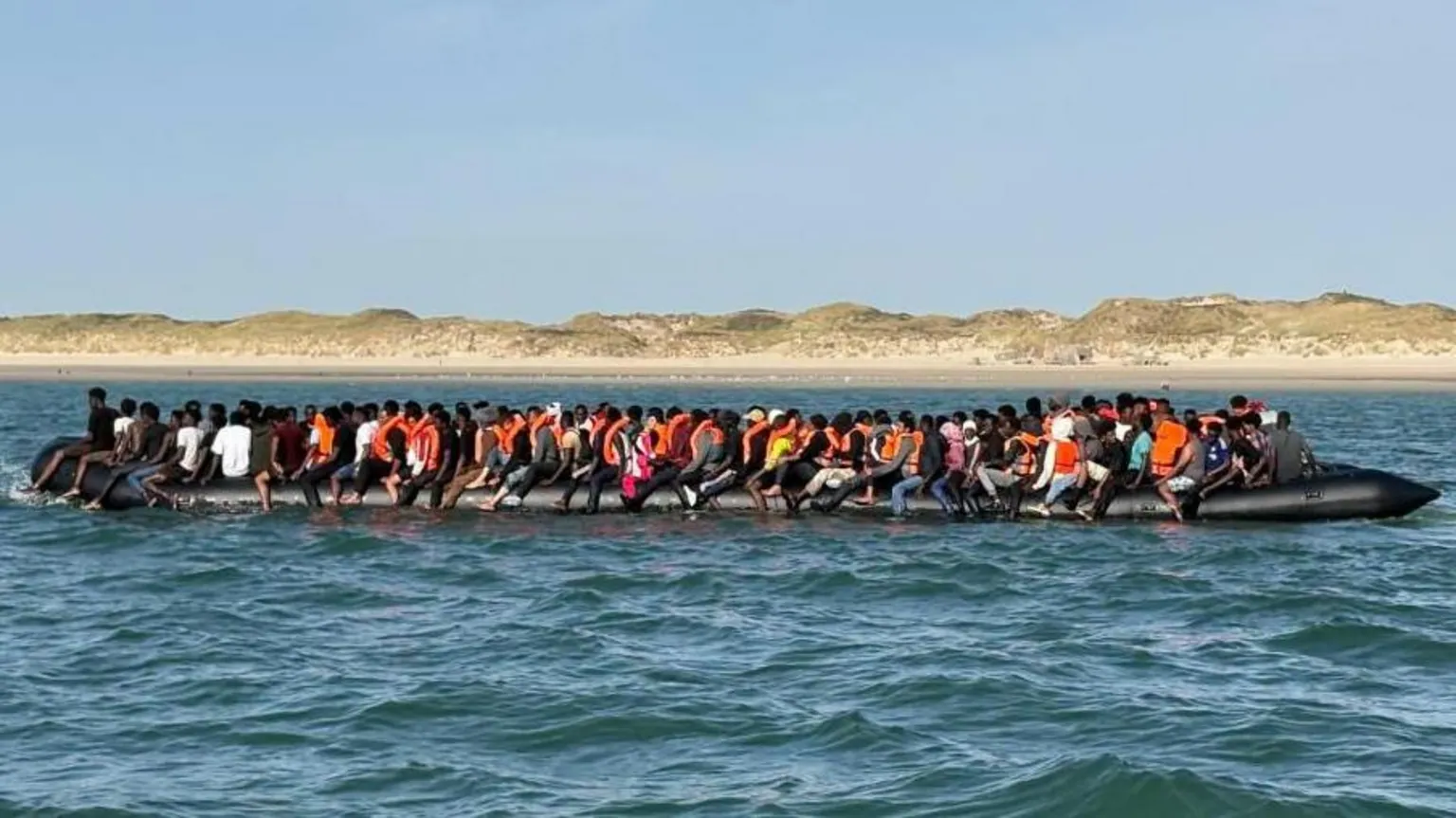 Record 230 people cross Channel in one small boat