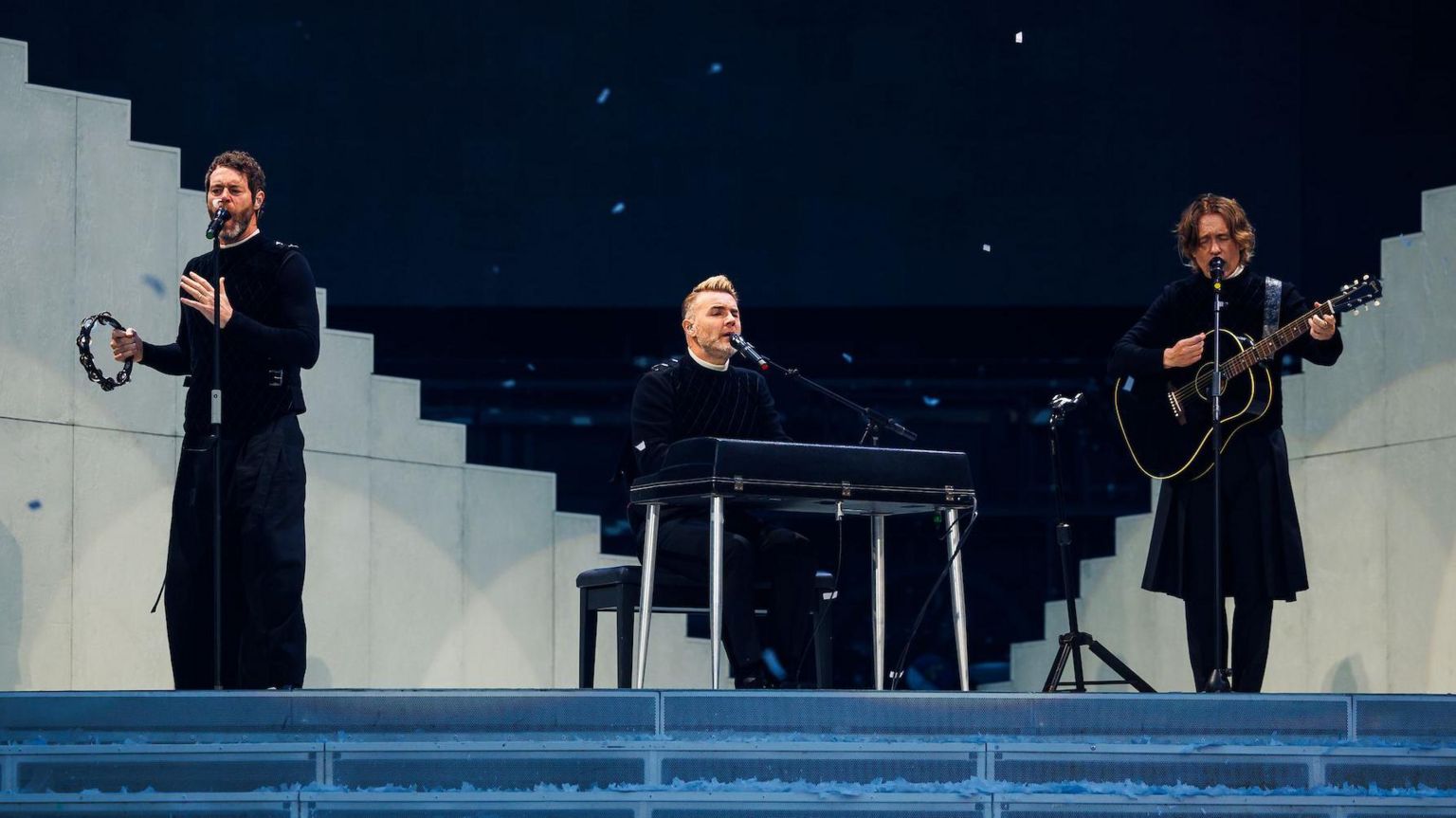 Gary Barlow and other members of Take That on stage at Ashton Gate in Bristol