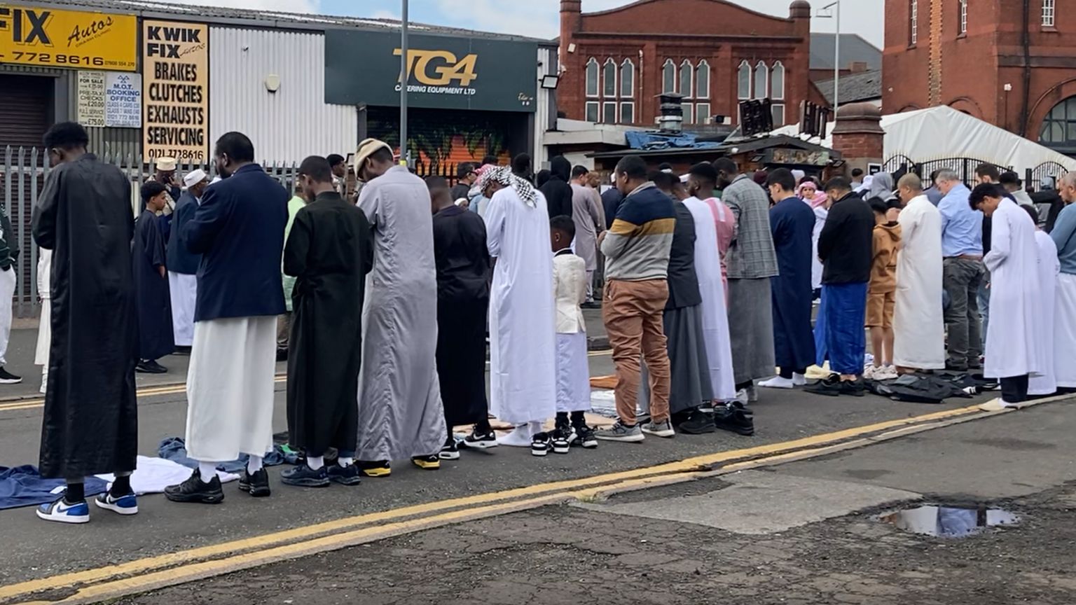 Muslim men praying in Small Heath