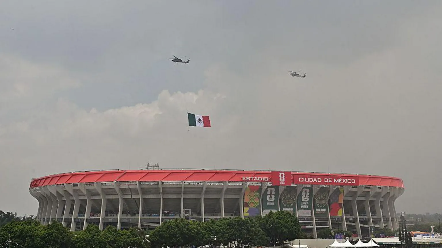 AFP via Getty Images Mexican Air Force helicopters with a Mexican flag fly over the opening ceremony ahead of the 2026 World Cup Group A football match between Mexico and South Africa