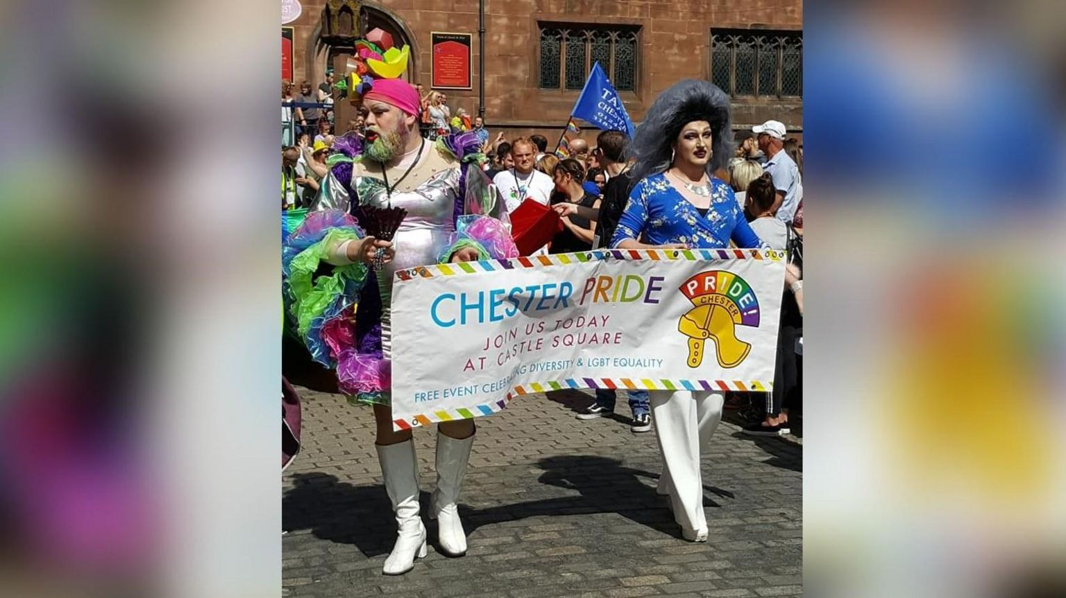 Lady Wanda Why with a fellow queen carrying a Chester Pride banner at a Chester Pride event