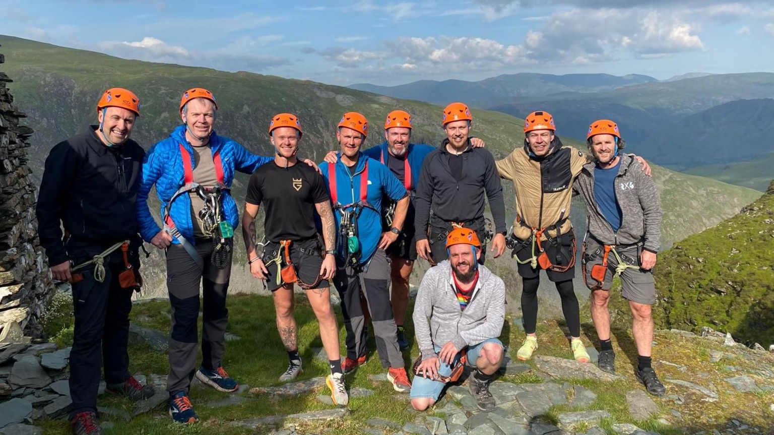 Nathan and a group posing after completing the via ferrata at Honsiter Slate Mine