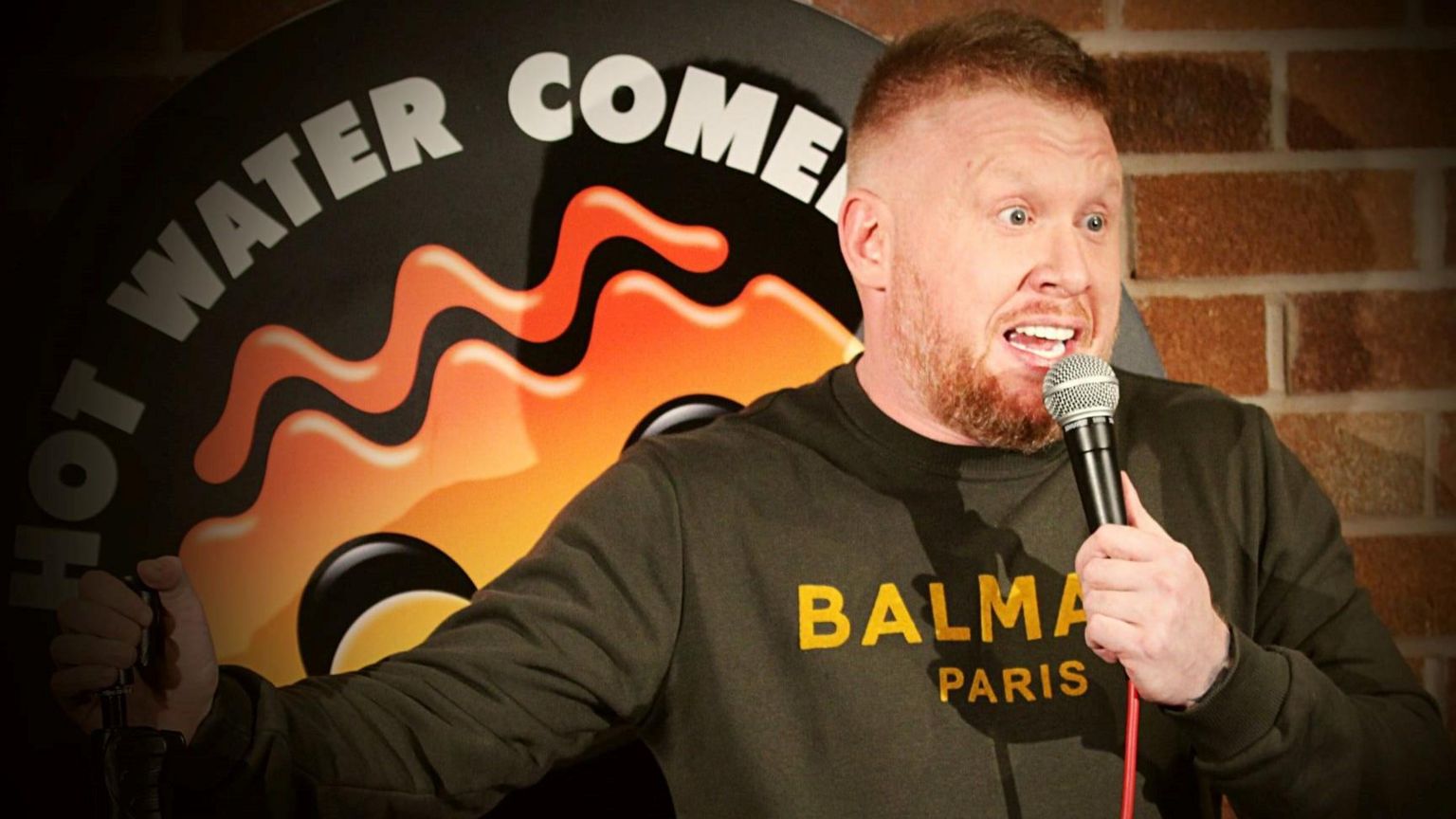 Paul Smith on stage at Hot Water Comedy Club in Liverpool