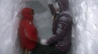 Guide Andy Bateman (L) and Joanne Whalley digging a snow hole