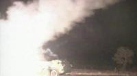 Rockets being fired into night sky from a truck