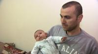 Khalid Hussein and his baby