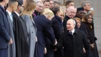 President Trump and President Putin shake hands