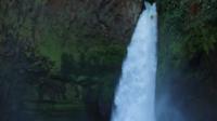 Kayak tumbilng down waterfall
