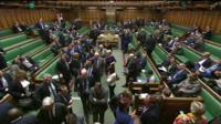 MPs leave the chamber to vote on an amendment