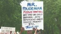 Protester carrying sign