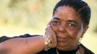 Cesaria holding her face in her hand
