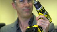 BBC Click's Spencer Kelly holding a drill